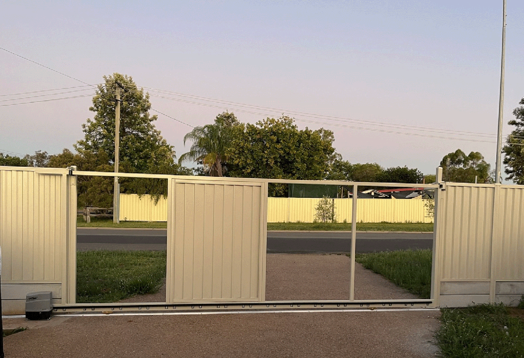 installing colour bond sheets into a driveway gate